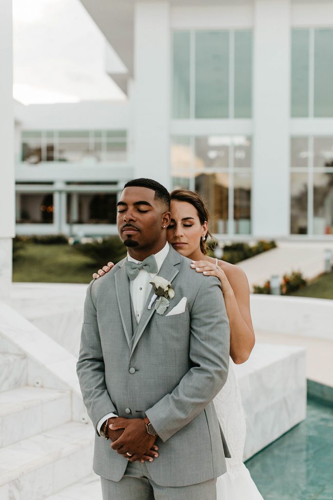 bride and groom hugging